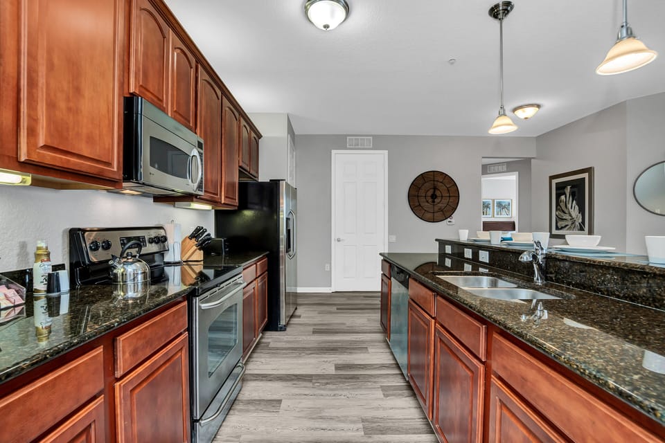 Casual Dining Delight: Relish in casual dining delight in our kitchen, where the countertop table provides a laid-back space for meals