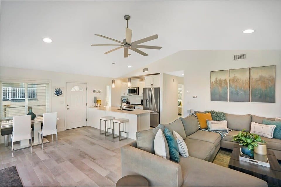 Masterful living room with large couch for spreading out and reclining! Ocean views from the windows and a big screen Smart TV with streaming apps and basic cable!