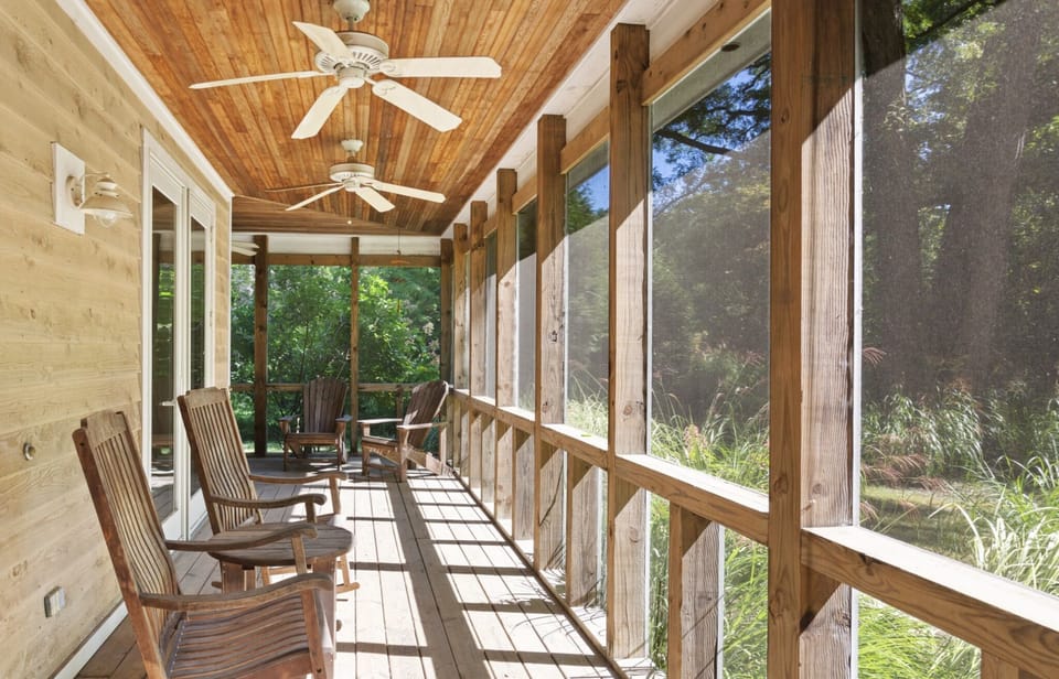 beautiful porch wraps around 2 sides of the house
