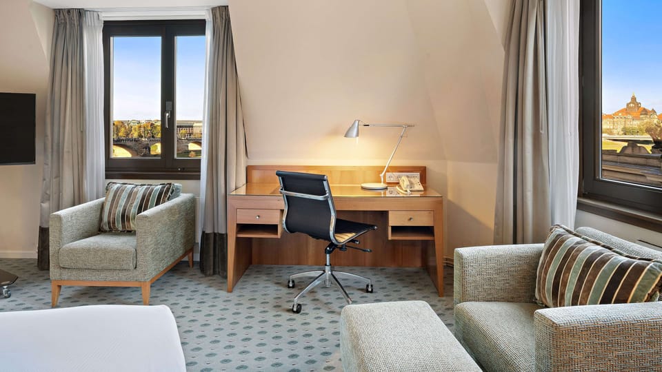 Executive Room, 1 Queen Bed, River View | Living area | LCD TV, MP3 dock