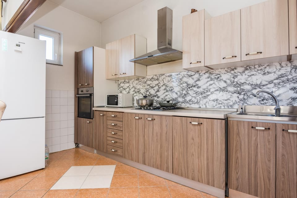 Family Apartment, Multiple Bedrooms, 2 Bathrooms (Pool Apartment Bakija) | Private kitchen | Fridge, microwave, oven, stovetop