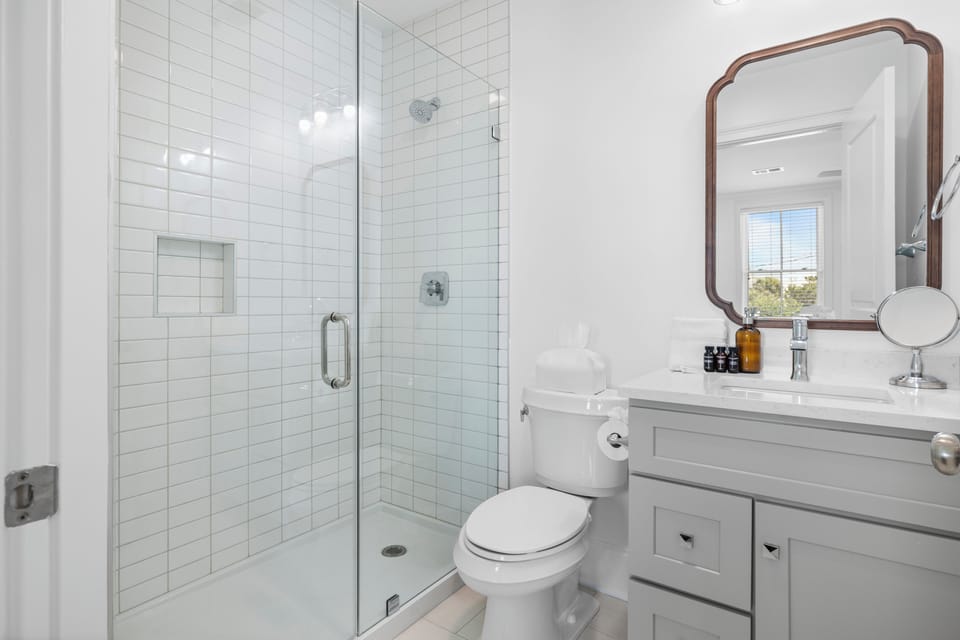 Ensuite bathroom features a walk-in shower, single vanity, and toilet. Attached to Bedroom 6. (Sand Dune)