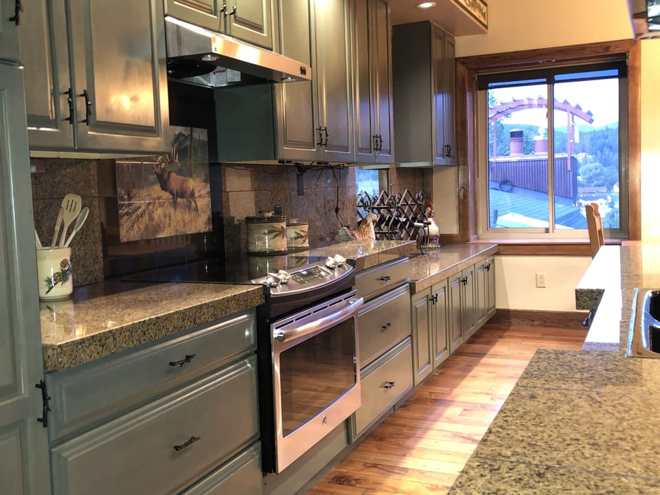 Kitchen has ample room and countertops for socializing and cooking.