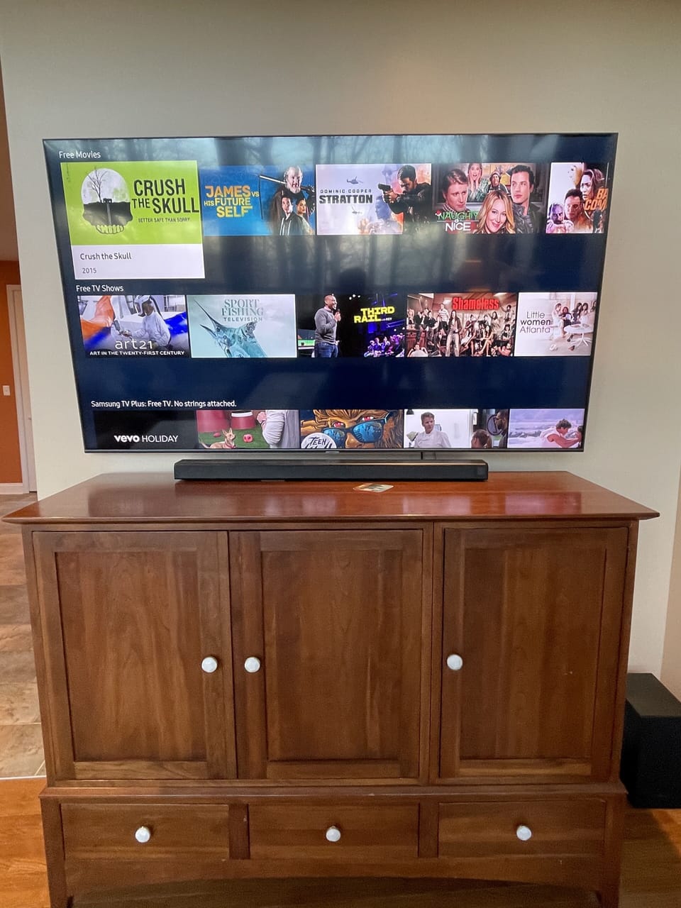 Brand new 75" Samsung QLED 4K TV in great room with sound bar and BOSE stereo.