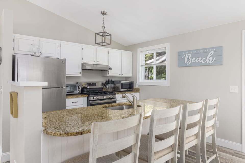 Kitchen w/ Refrigerator, Dishwasher, Toaster, Coffee Maker, Microwave and more.