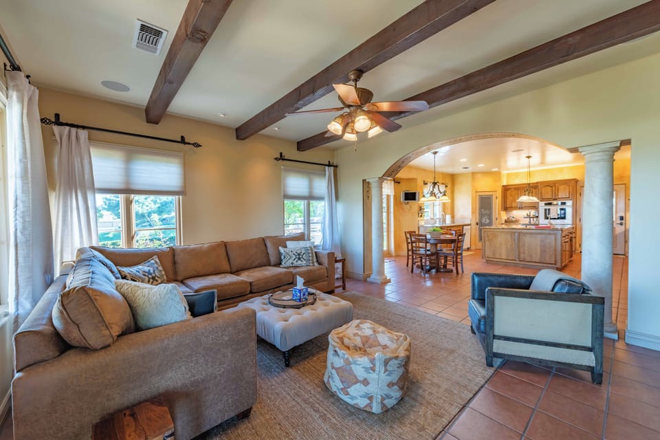 Unwind in your spacious living room with rustic beams overhead and an open flow to the gourmet kitchen.