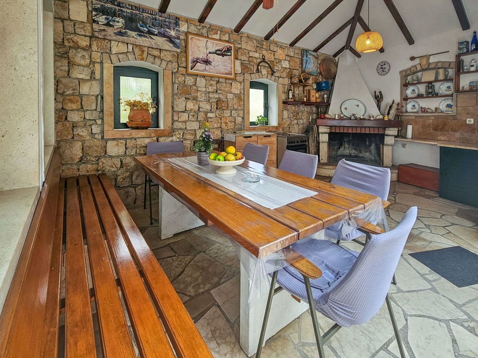 Furniture, Wall, Wood, Table, Flooring, Interior Design, Chair, Ceiling, Door, Stone Wall