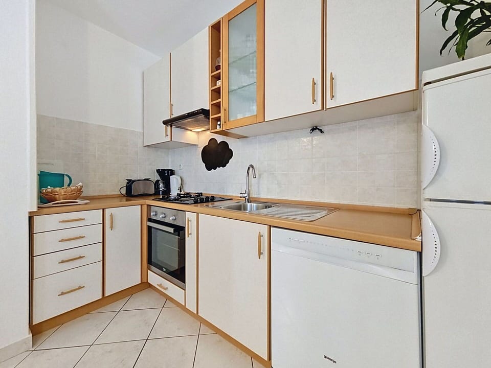 Countertop, Kitchen, Kitchen Appliance, Major Appliance, Wood, Cabinetry, Flooring, Furniture, Interior Design, Floor
