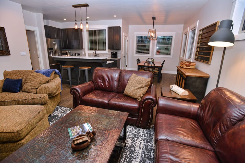 Living room with dining and kitchen behind.