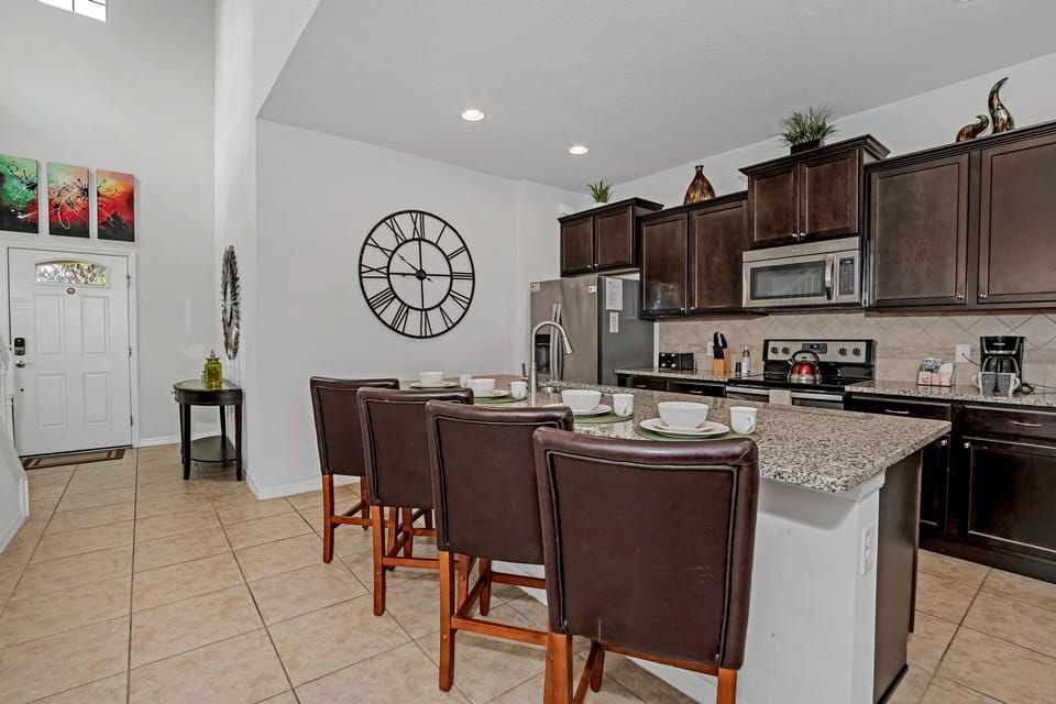 Gather around our stunning 6-person dining table amidst elegant decor.