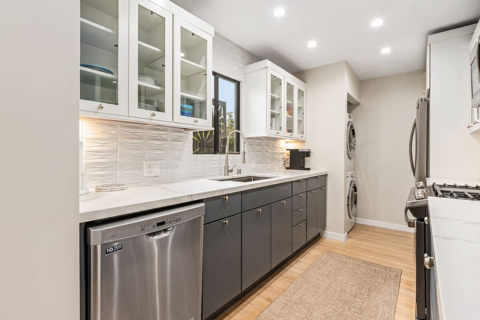 The remodeled kitchen includes a new, full-sized washer and dryer