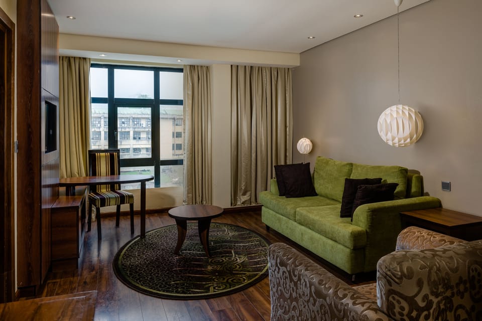 Executive Suite, 1 Bedroom, Smoking | Living area | LCD TV, first-run movies