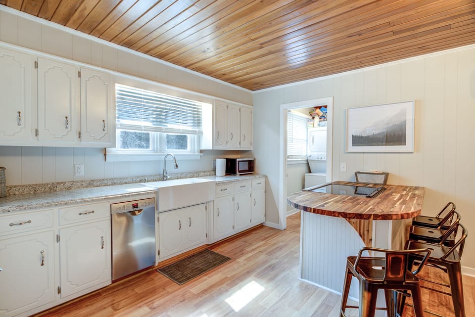 Fully equipped kitchen with new SS appliances and an island for eating. 