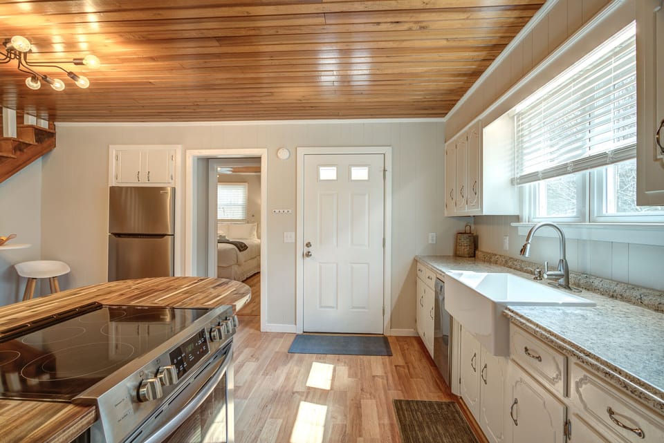 Kitchen door leads to the outside porch. Downstairs bedroom is off the kitchen.