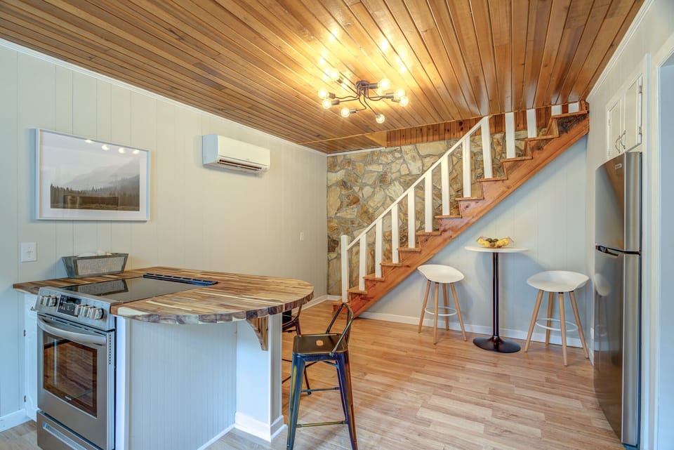 Bistro table.  Stairs lead from living room (up) to kitchen/dining area (down).