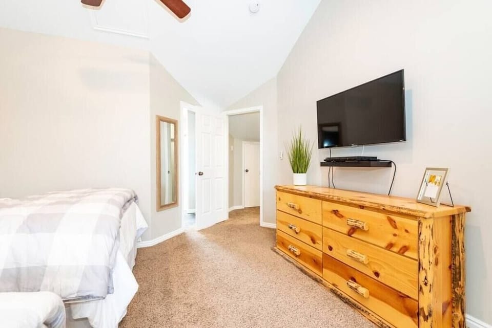 The primary bedroom boasts plenty of storage and a large screen Smart TV!