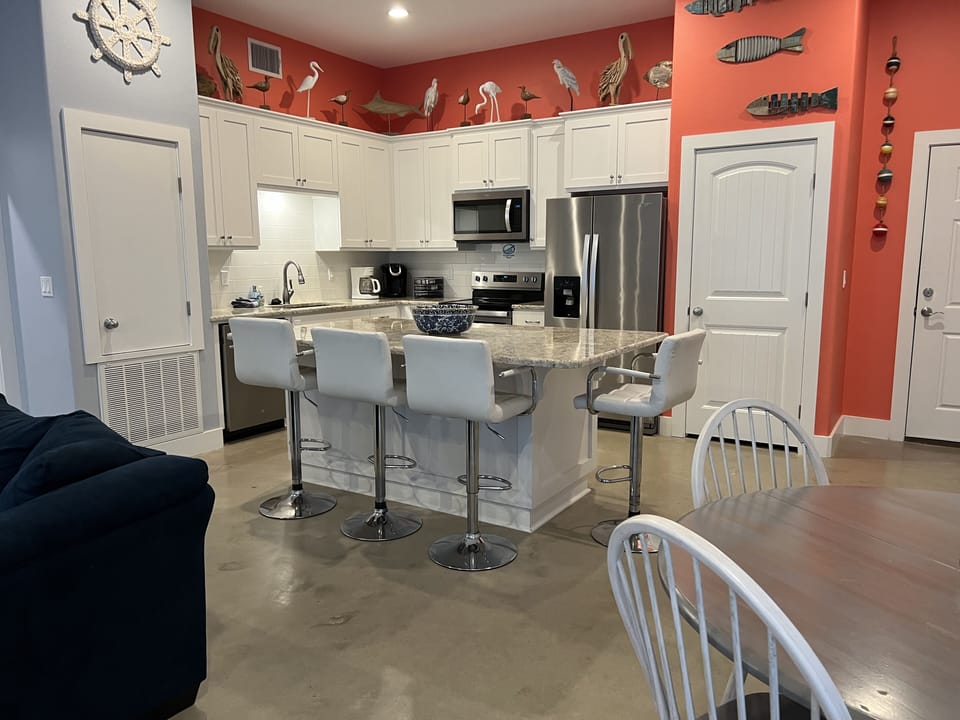 Full size kitchen with seating for 4 at the island and 4 at the dining table