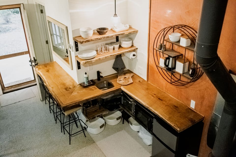 Kitchen view from loft.  Fridge, 2 burner cooktop, microwave, small convec oven.