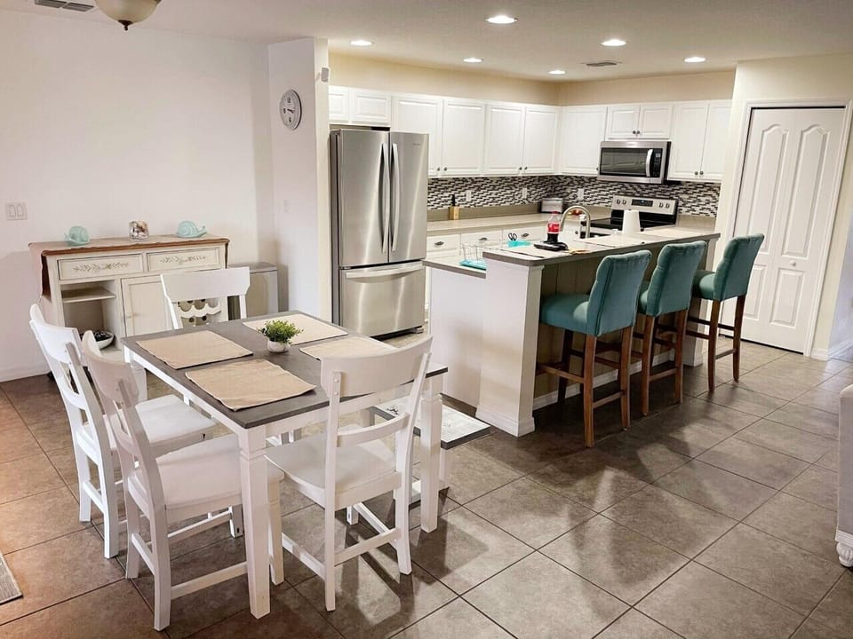 Fully equipped kitchen and more seating for nine. 