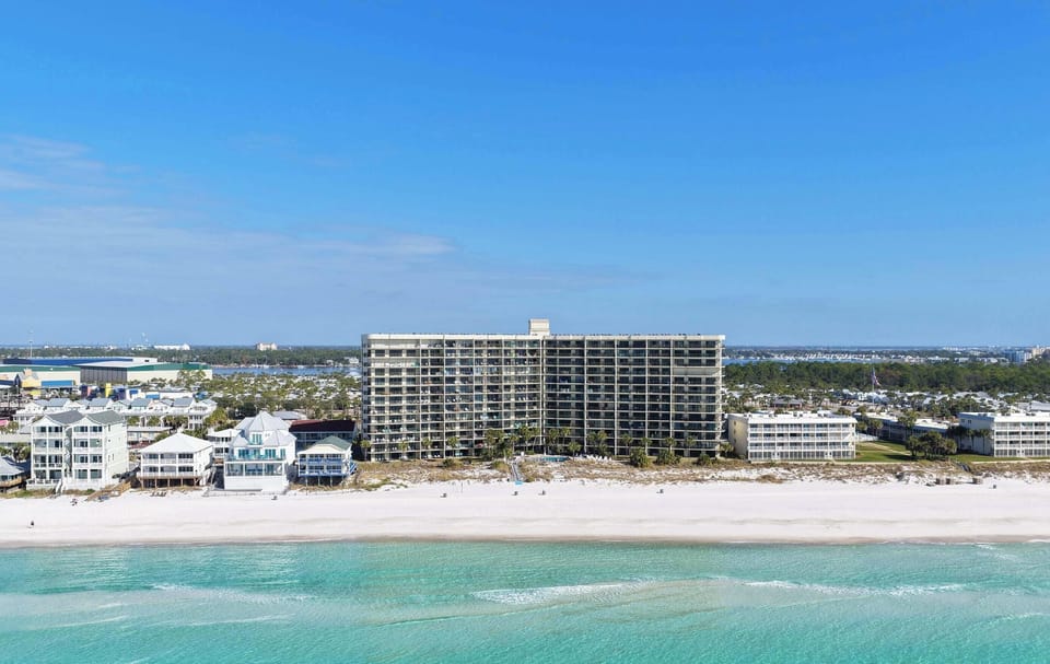 Toes in the sand, eyes on the Gulf — The Commodore's front-row seat to it all.