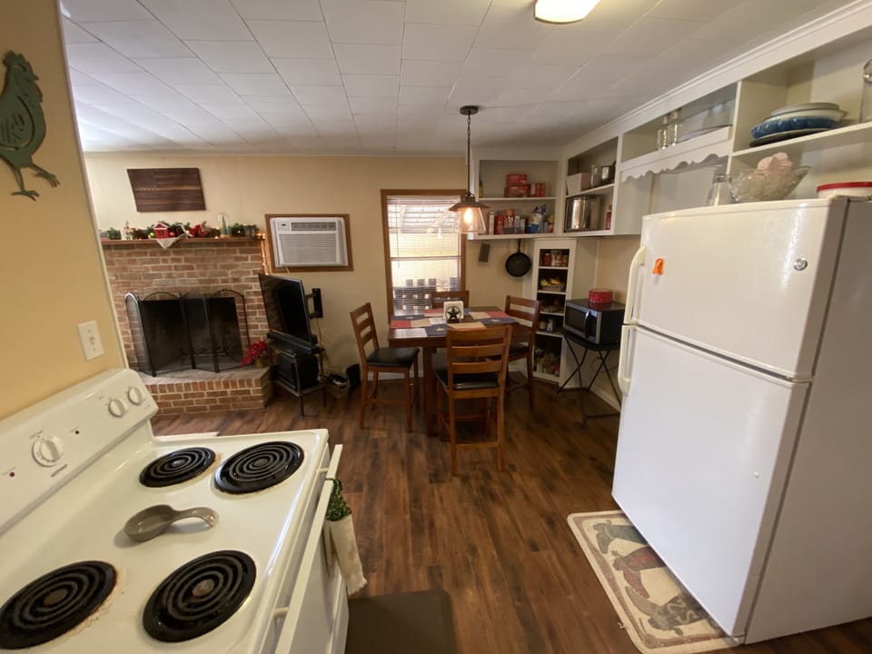 Dining area with lots of cupboard/pantry space.