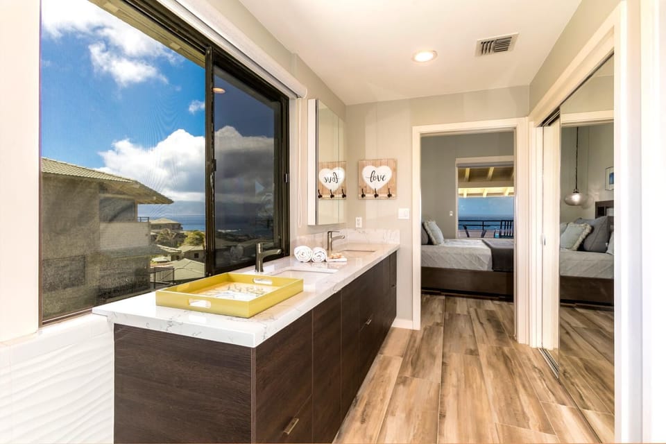 Begin and end your days in style with a double vanity, open views, and a relaxing rain-style shower    