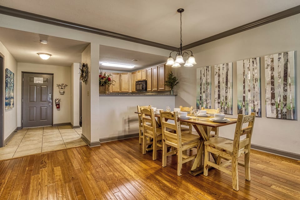 Dining area features a large wood table, perfect for dining in or playing games