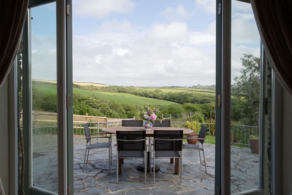 The Stables - Lounge view of the patio and beyond over the valley.