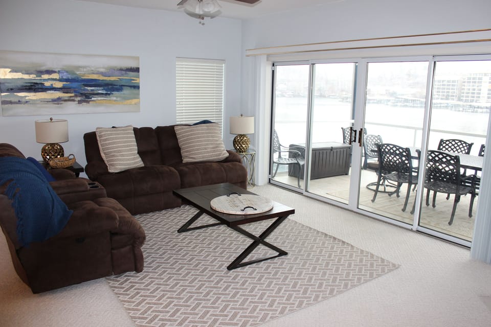 Enjoy the sounds of the lake by opening the sliding glass doors