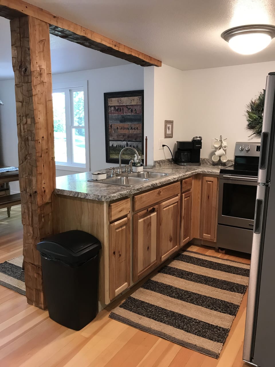Kitchen includes Refrigerator, Stove, Microwave & Keurig Coffee Maker.