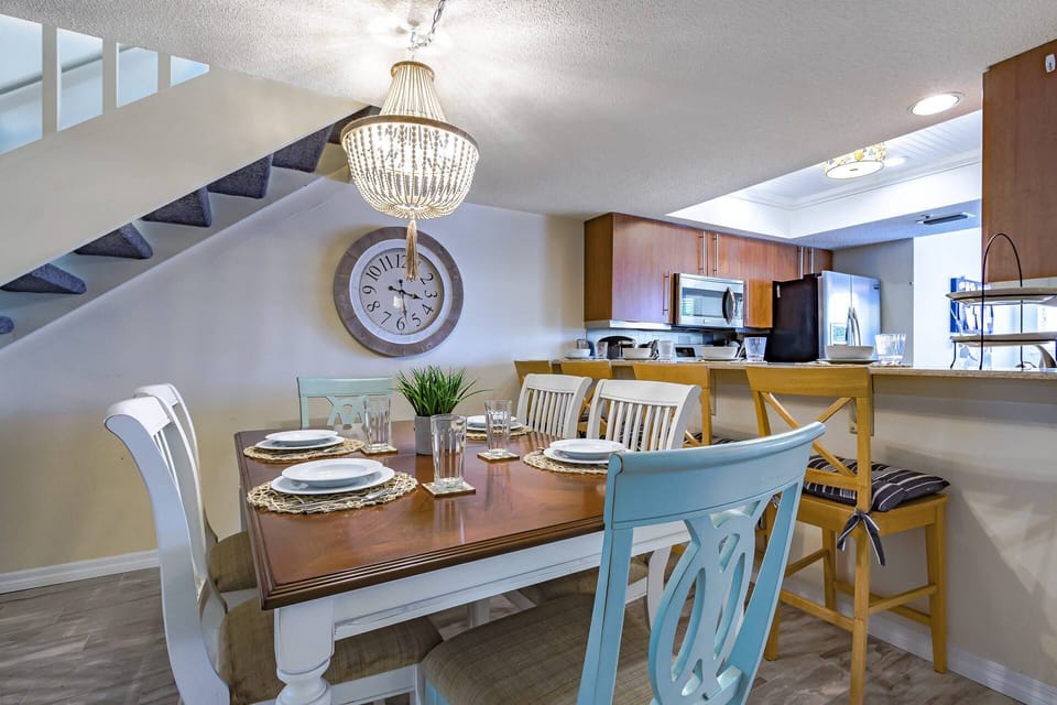 Dining table for 6 plus 4 seats at the granite bar.  Another table for 4 off the kitchen. Plenty of options at dinnertime!