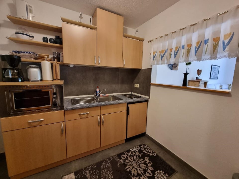 Comfort Apartment | Private kitchen | Fridge, microwave, stovetop, electric kettle