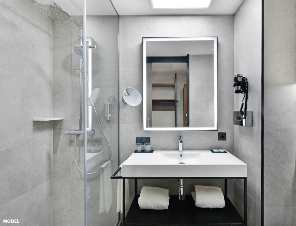 Eco-friendly toiletries, hair dryer, towels, soap