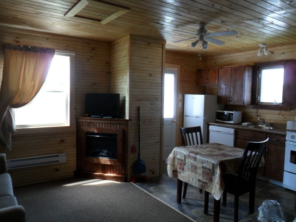 Cabin, Fireplace (Cottage 10) | Living area | Flat-screen TV