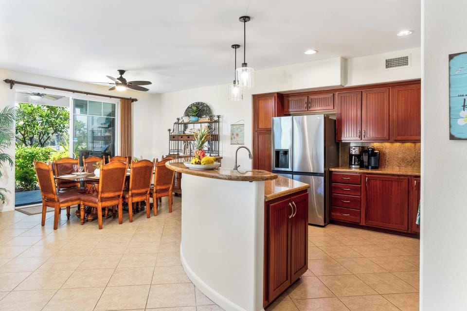 Fully stocked kitchen with granite countertops and stainless steel appliances