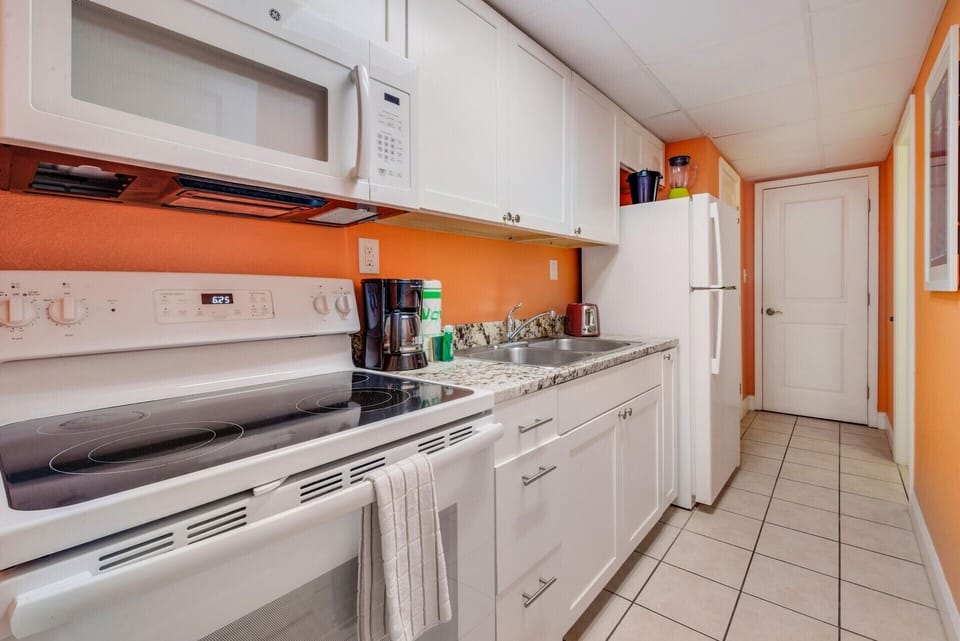 A fully equipped separate kitchen with full-sized appliances