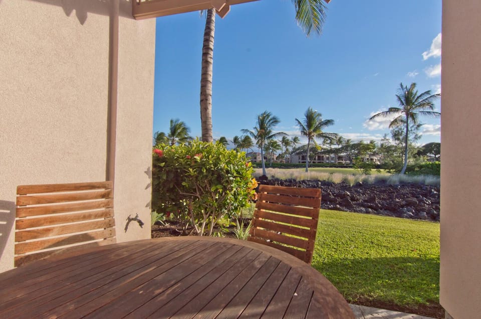 Covered lanai with golf course views