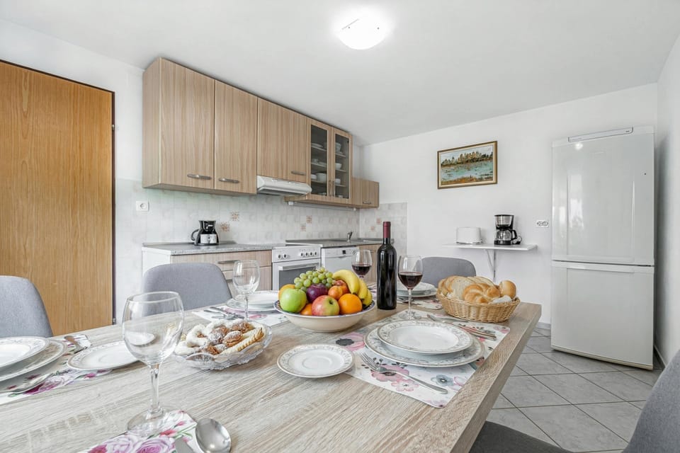 Family House, 2 Bedrooms, Fireplace (Mržek House with Sauna) | Private kitchen | Fridge, oven, stovetop, dishwasher