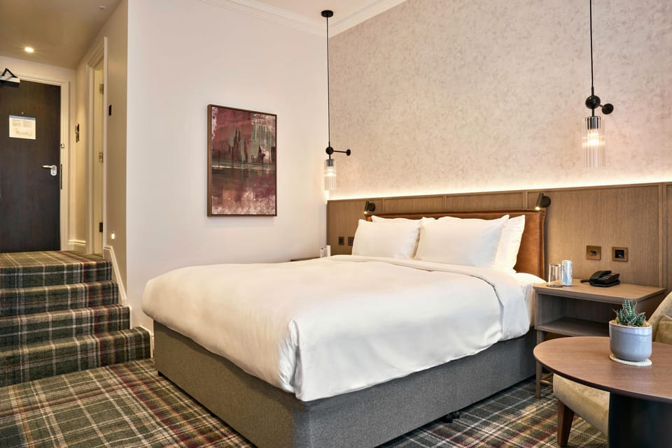 Deluxe Room (King) | Premium bedding, in-room safe, desk, iron/ironing board