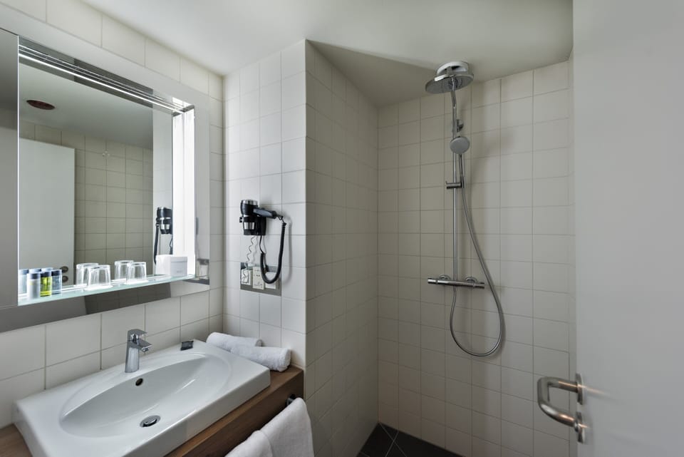 Combined shower/tub, eco-friendly toiletries, hair dryer, slippers