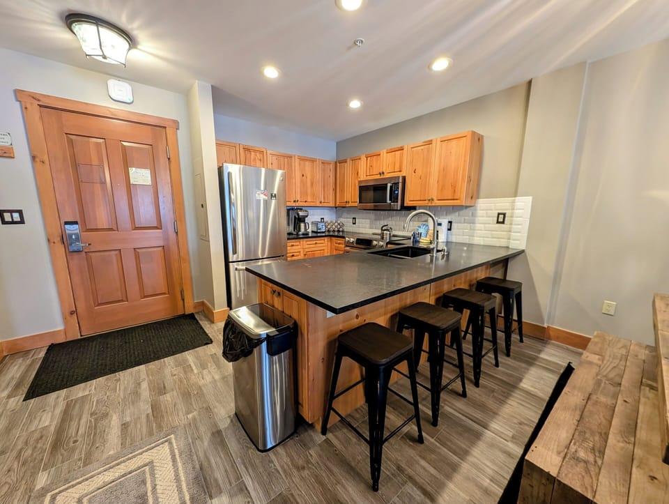 Bright kitchen with bar stool seating