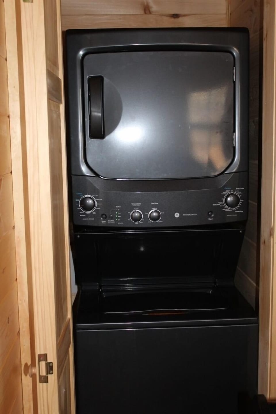 stacked washer dryer for guest use;
 detergent provided