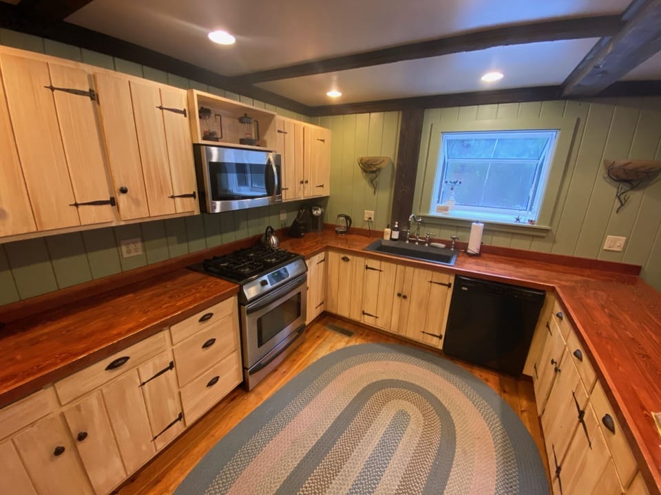 Enjoy a kitchen stocked with cookware, dishes, and a variety of other supplies.