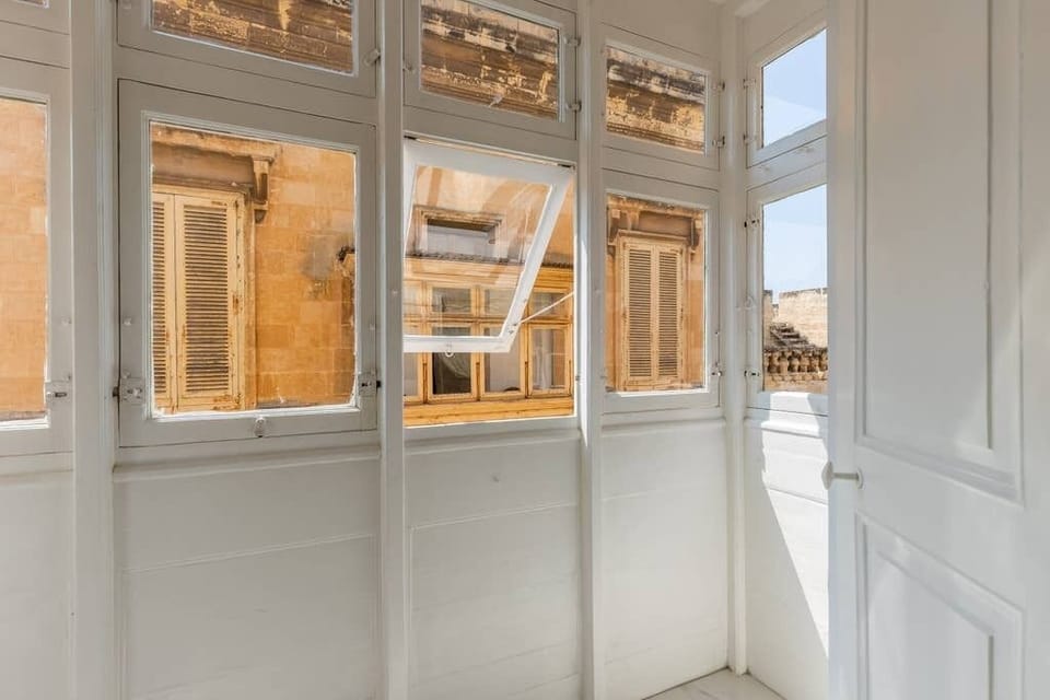 Your bedroom's traditional Maltese closed balcony. 