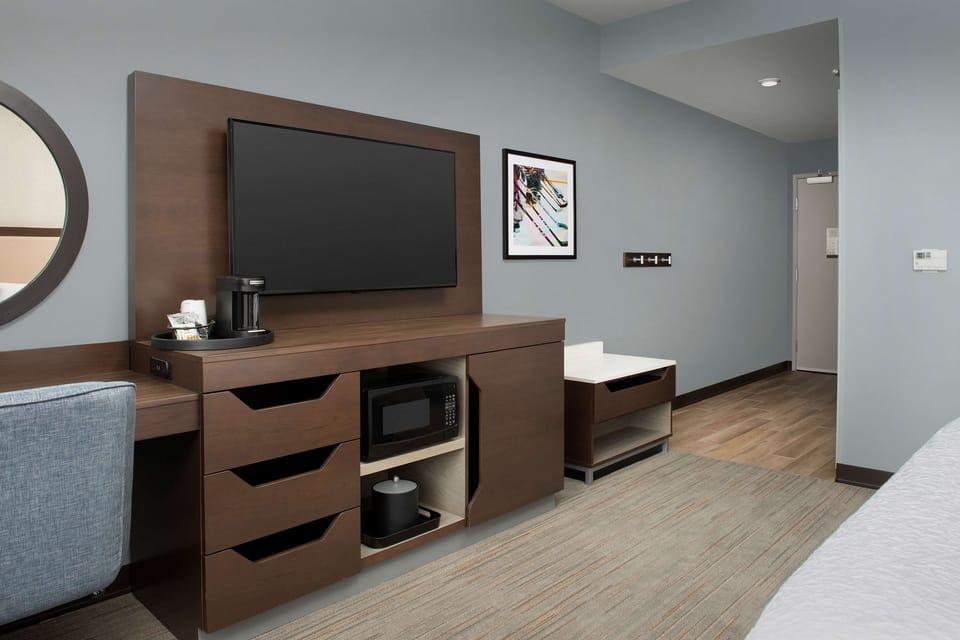 Desk, laptop workspace, bed sheets