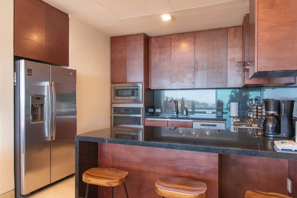 Contemporary kitchen setup, featuring high-end appliances and ample counter space.