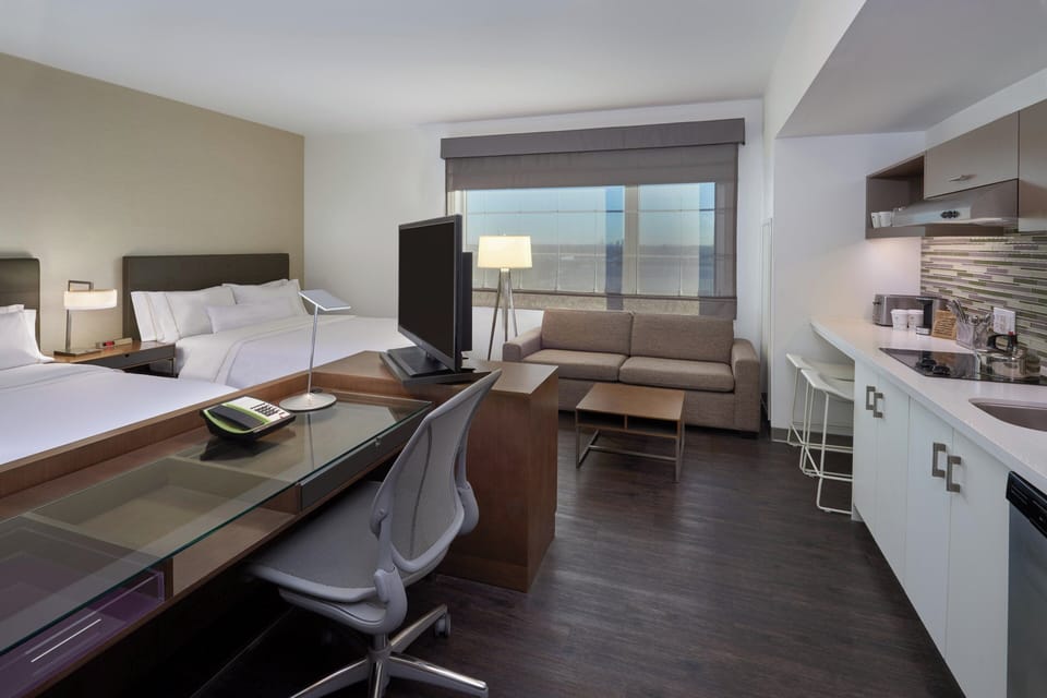Studio, 2 Queen Beds | Hypo-allergenic bedding, down comforters, in-room safe, desk