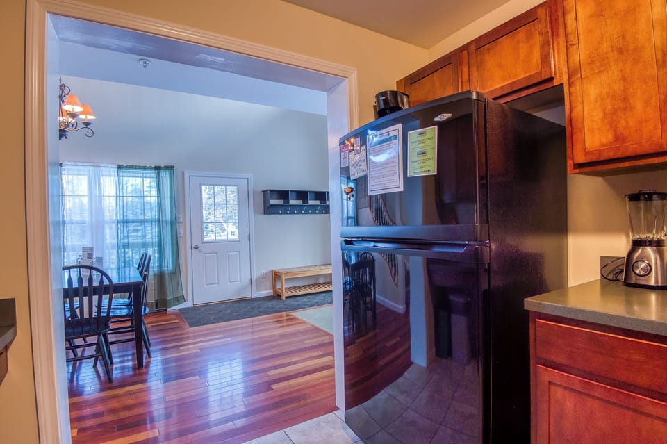 Guest information and parking passes located on the fridge.