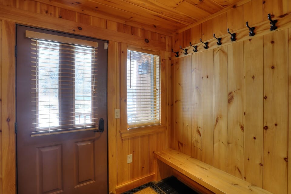 Entryway with plenty of hooks to store winter gear!