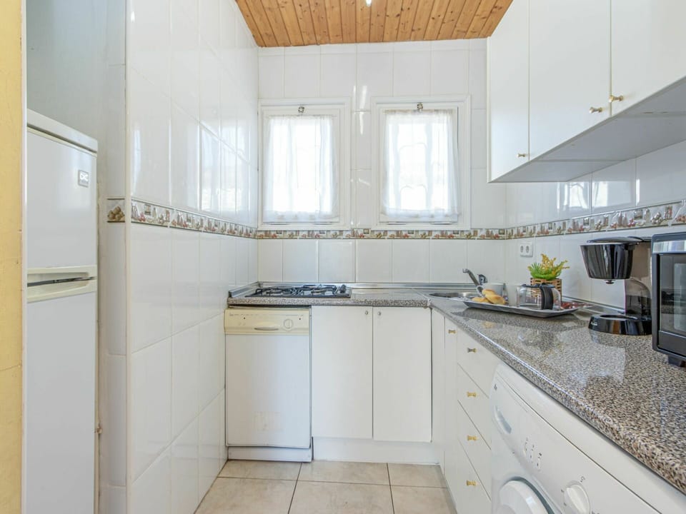 Property, Room, Kitchen, Cabinetry, Building, Countertop, Furniture, Interior Design, House, Yellow